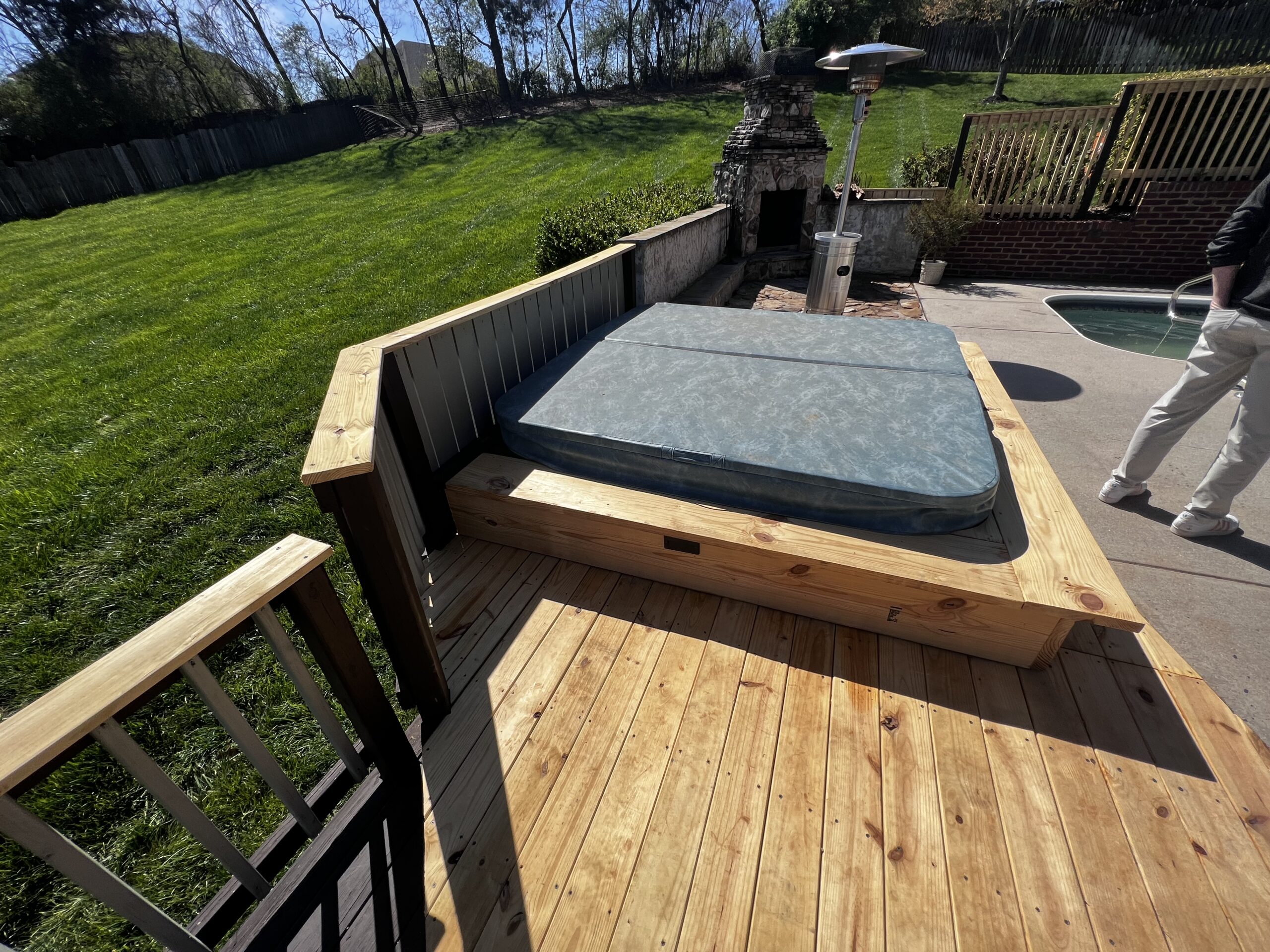 Newly built deck with a custom hot tub enclosure completed.